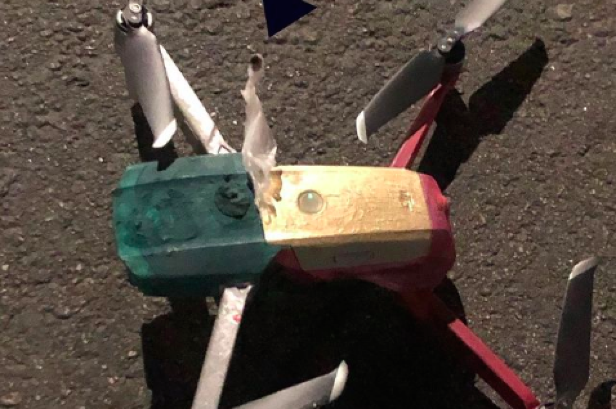 A drone with what police suspect to be heroin attached to it