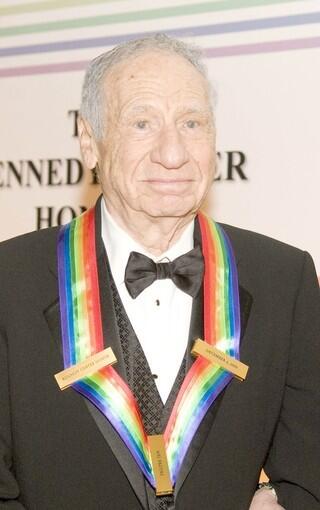 Mel Brooks shows off his Kennedy Center Honors lifetime achievement award.