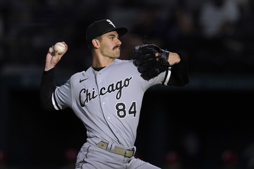 Chicago White Sox starting pitcher Dylan Cease throws to a Texas Rangers batter during the first inning of a baseball game Friday, Aug. 5, 2022, in Arlington, Texas. (AP Photo/Tony Gutierrez)