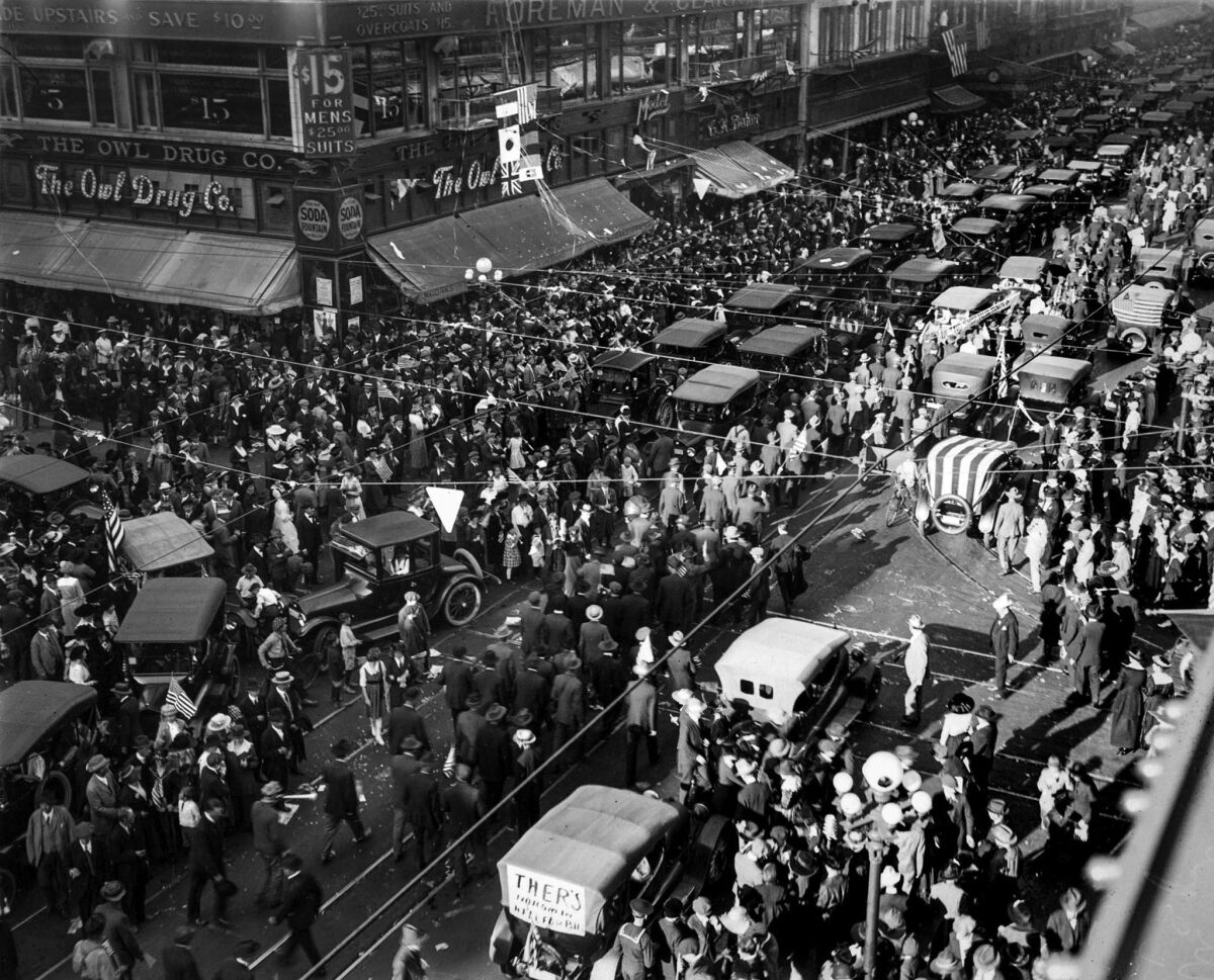 Nov. 11, 1918: At Fifth and Broadway traffic moved at a crawl as thousands jammed streets after the news of Germany's surrender ending World War I.