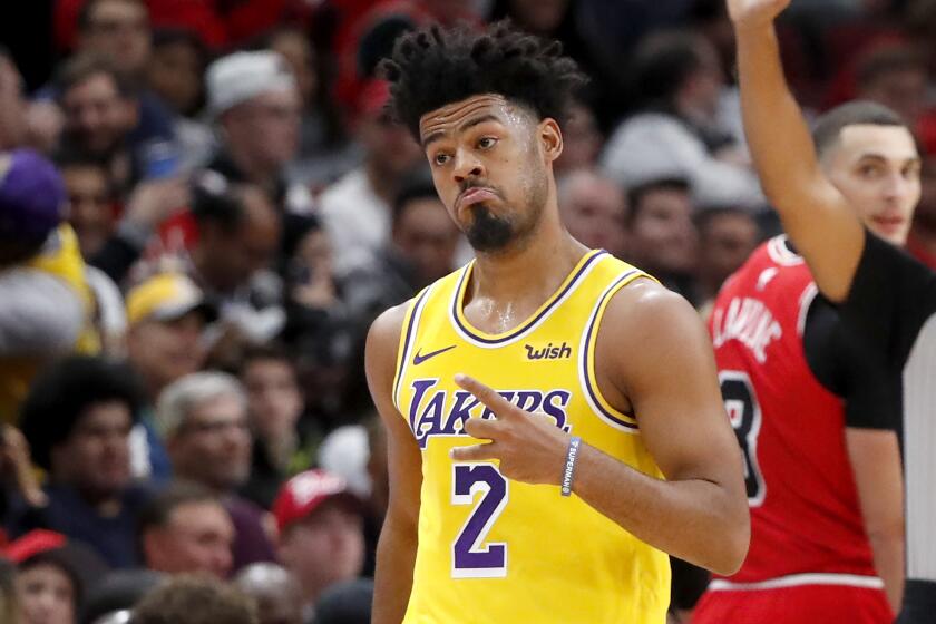 Los Angeles Lakers' Quinn Cook looks back at his bench and reacts after hitting a three-pointer during the second half of an NBA basketball game against the Chicago Bulls Tuesday, Nov. 5, 2019, in Chicago. The Lakers won 118-112. (AP Photo/Charles Rex Arbogast)