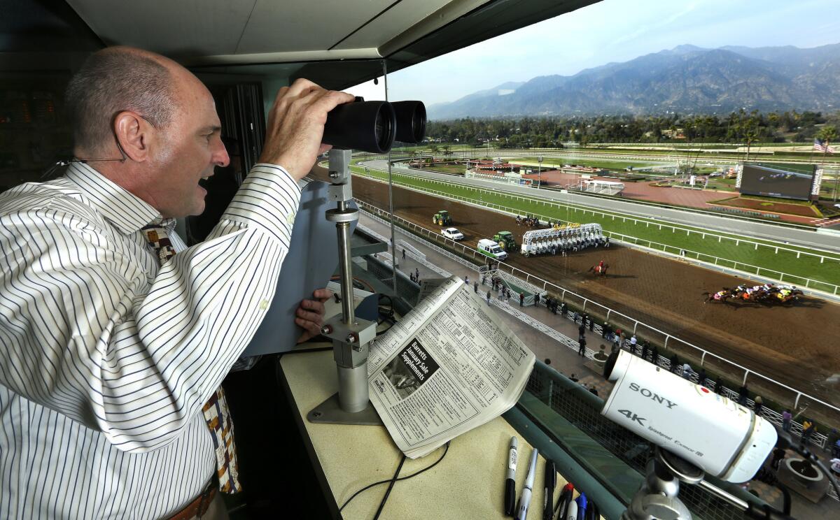 Michael Wrona calls a race at Santa Anita Park on Jan. 14, 2015.