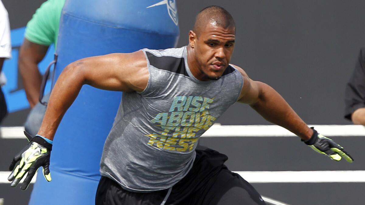 UCLA linebacker Anthony Barr runs an obstacle course during the Bruins' pro day in March. Barr's switch from running back to linebacker played a pivotal role in his rise to becoming a top NFL draft prospect.
