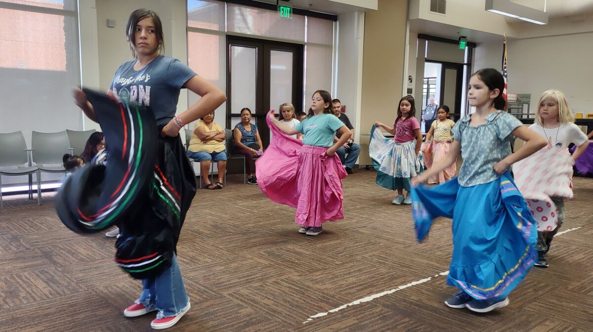 Dixie Dukes, left, leads Ballet Folklorico students as they practice at 4 p.m. Wednesdays at Ramona Community Library.