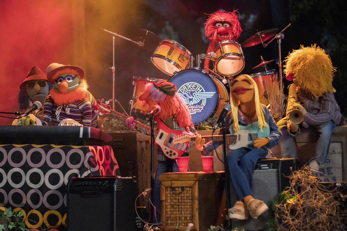 A band of Muppets plays the keyboard, guitar, drums and saxophone.