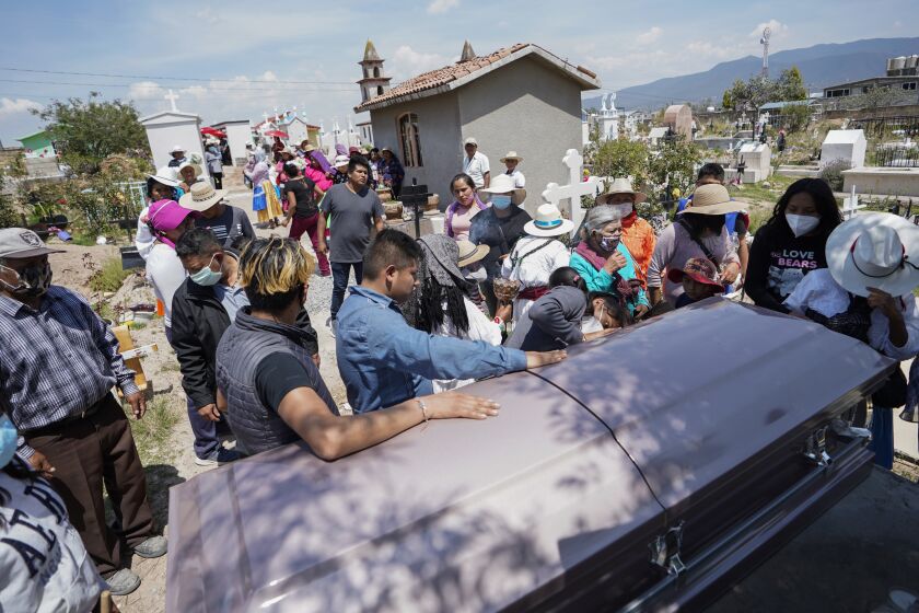 Amealco de Bonfil, Quertaro - May 27: The casket of Maria Eugenia Chavez-Segovia is placed at the center of the cemetery for a last goodbye at Tultepec Cemetery on Thursday, May 27, 2021 in Amealco de Bonfil, Quertaro (Alejandro Tamayo / The San Diego Union-Tribune)