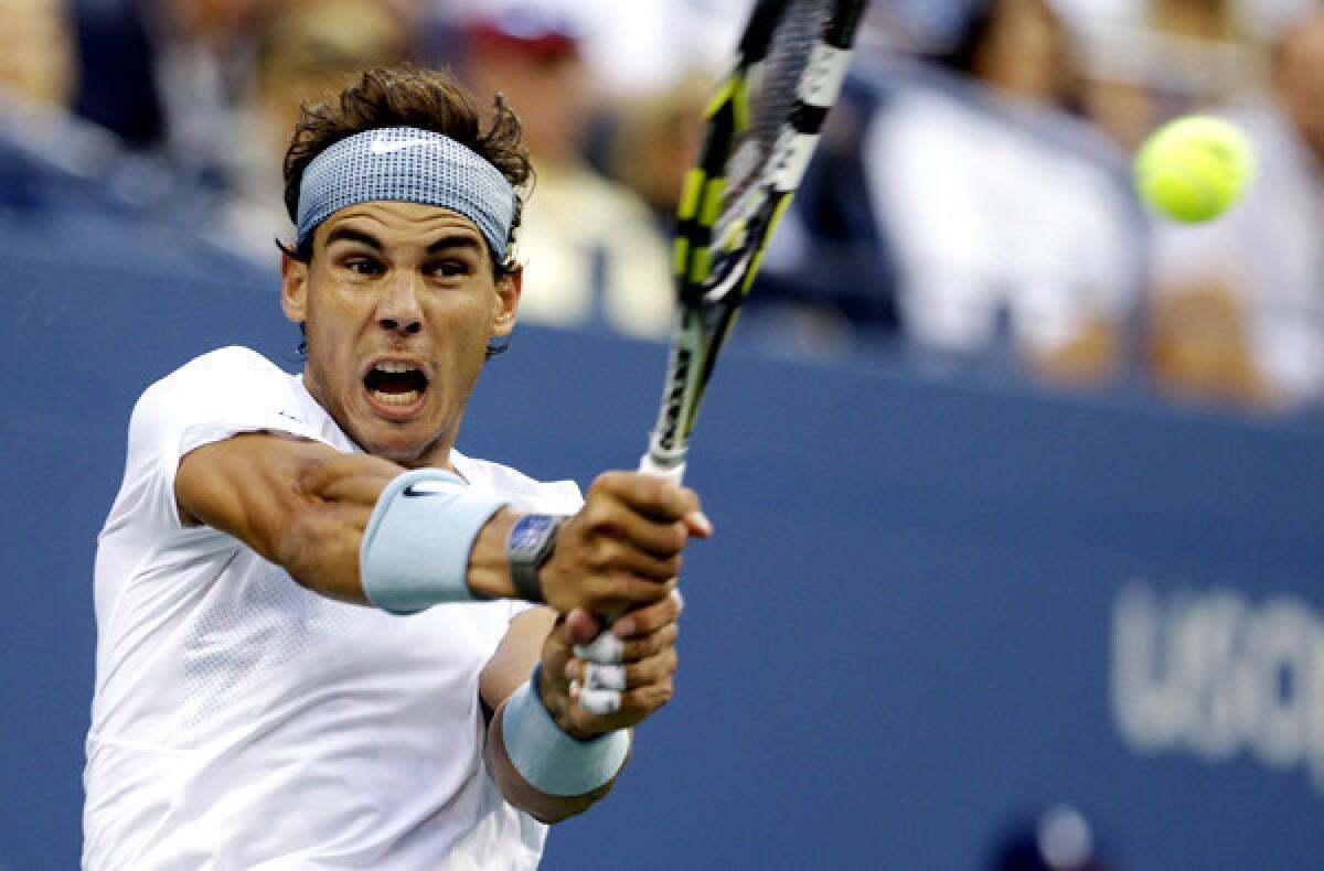 Rafael Nadal gets into a backhanded return in his semifinal match against Richard Gasquet on Saturday at the U.S. Open.