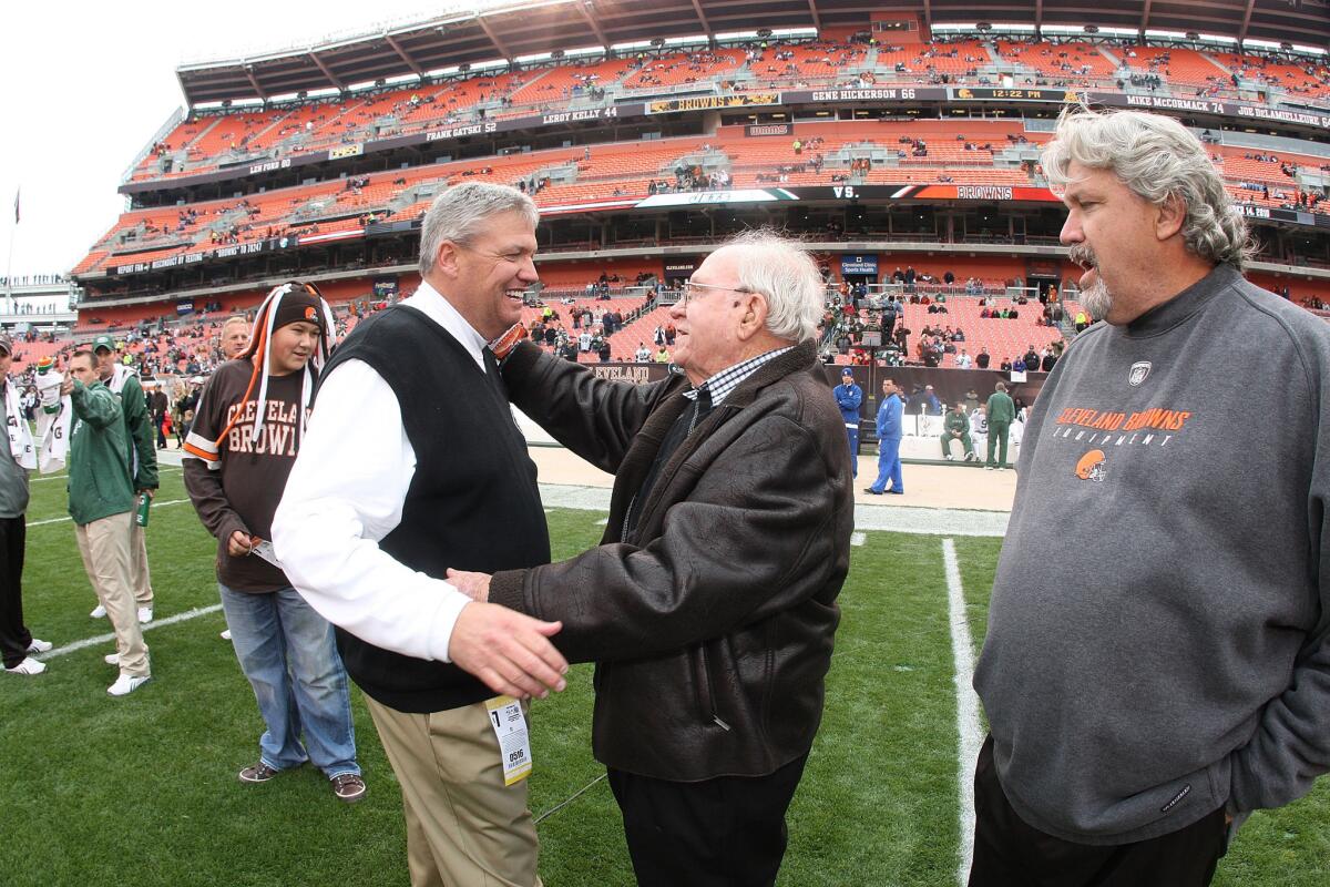 Buddy Ryan, center, with his sons Rex, left, and Rob in 2010.