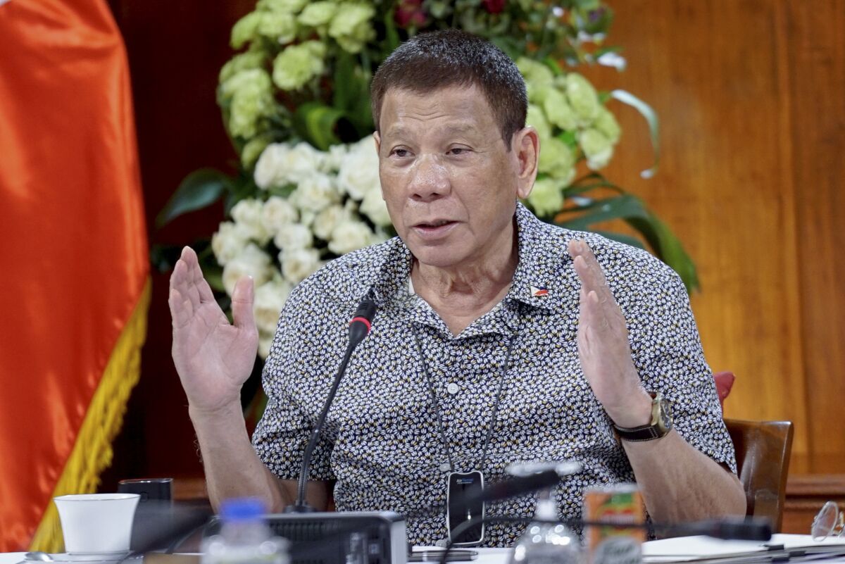 In this handout photo provided by the Malacanang Presidential Photographers Division, Philippine President Rodrigo Duterte gestures as he meets members of the Inter-Agency Task Force on the Emerging Infectious Diseases at the Malacanang presidential palace in Manila, Philippines on Monday Aug. 30, 2020. Duterte publicly ordered the country's top customs official to shoot and kill drug smugglers in one of his most overt threats during a deadly four-year campaign that has been the centerpiece of his presidency. (King Rodriguez/Malacanang Presidential Photographers Division via AP)