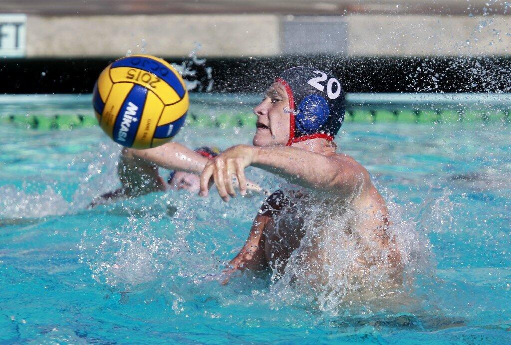 Regency Water Polo's Lucas Wyatt shoots the ball during the first half against Stanford in the USA Junior Olympics 18U boys' bronze match at the William Woollett Aquatic Center in Irvine on Tuesday.