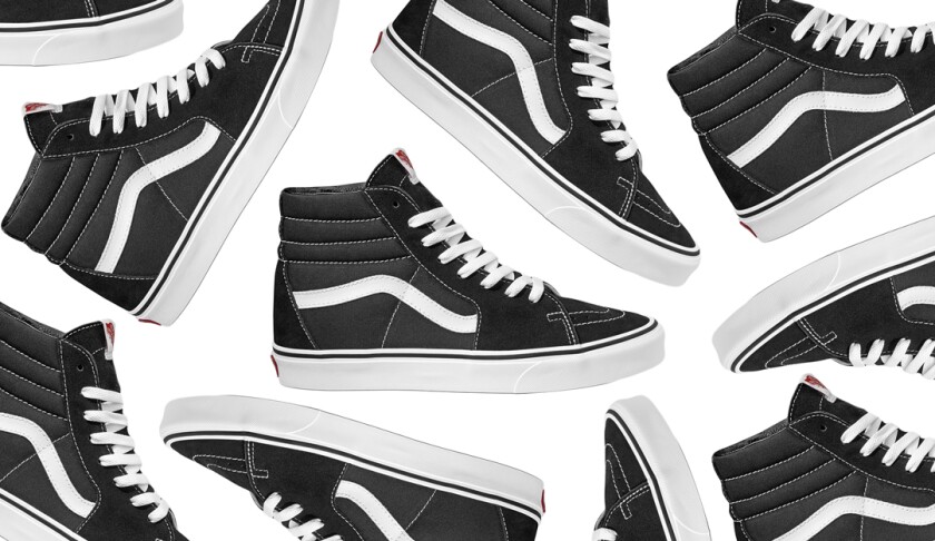 A photo of a black high-top sneaker with a white sidestripe and white stitching.