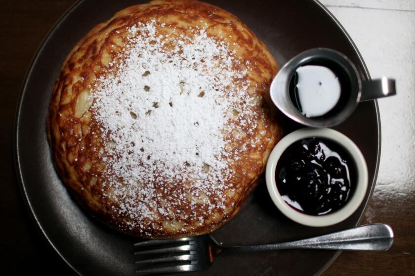 Cooks County's 10-inch, iron skillet cooked pancake comes with blueberry compote and maple syrup.