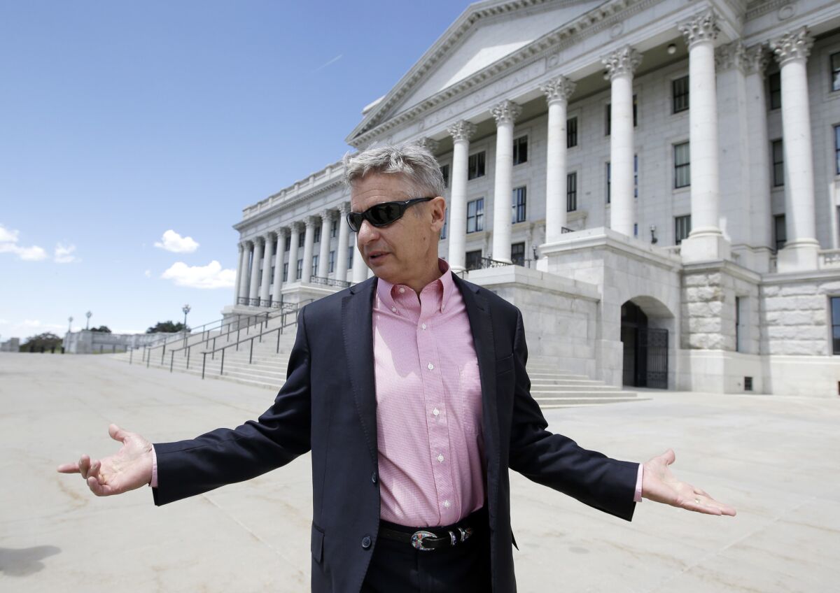 Libertarian presidential candidate and former New Mexico Gov. Gary Johnson leaves the Utah State Capitol in Salt Lake City.