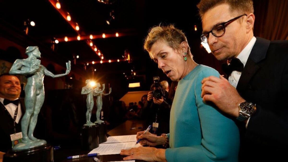 Frances McDormand and Sam Rockwell backstage after winning Outstanding Performance by a Cast in a Motion Picture, "Three Billboards Outside Ebbing, Missouri" at the 24th Screen Actors Guild Awards.