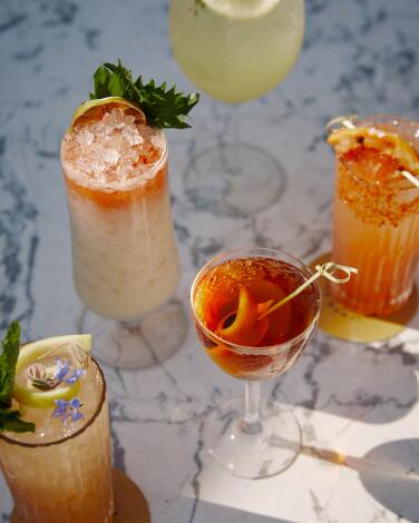 Five different cocktails on a tabletop