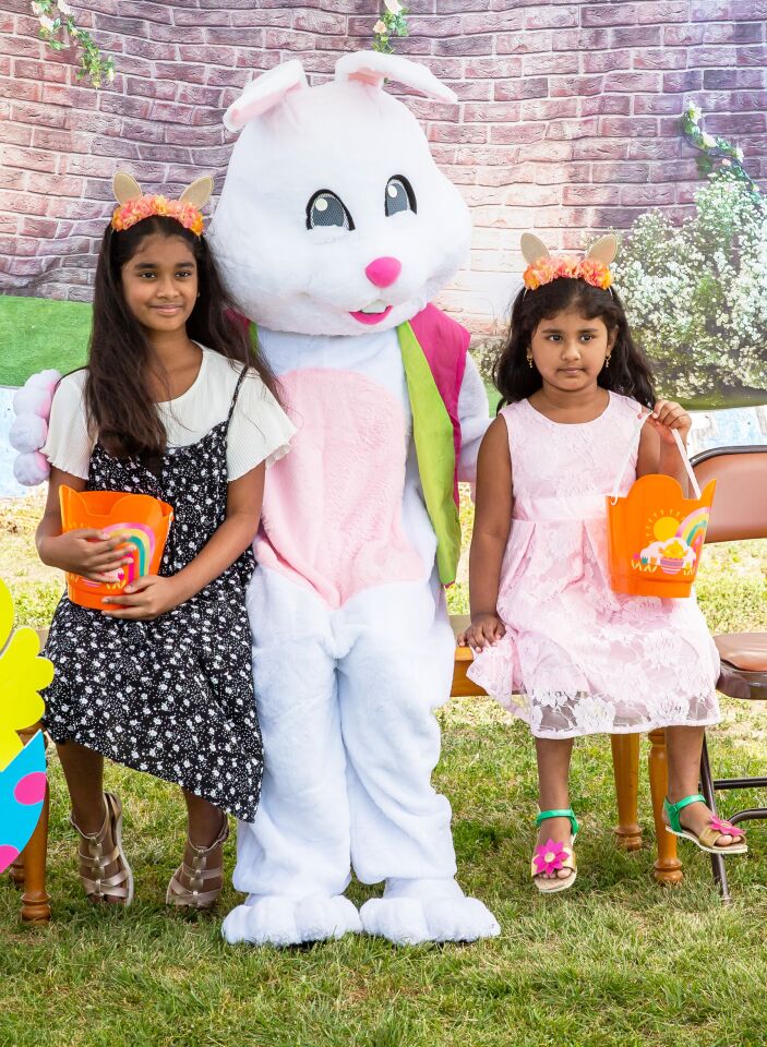 Ariana Patakunta, 9, and her 4-year-old sister, Nirvana, with the Easter Bunny.