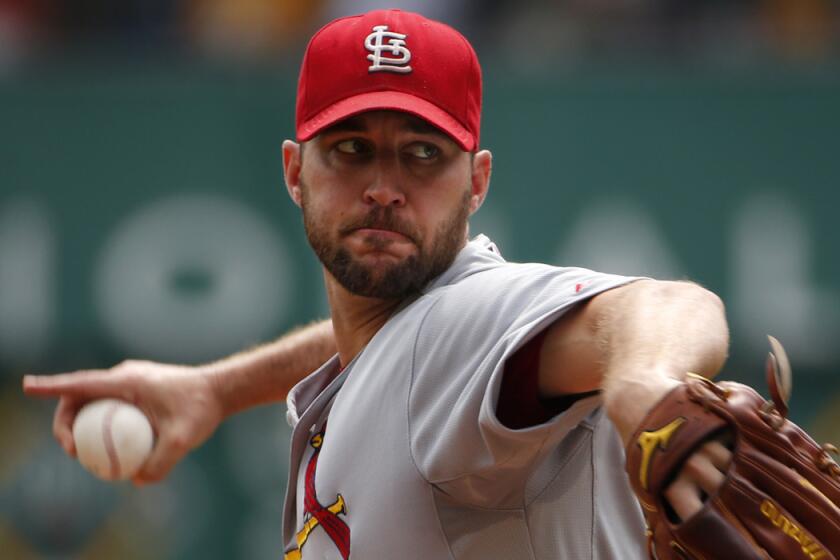 St. Louis Cardinals' Adam Wainwright warms up before a game against the Pittsburgh Pirates on Aug. 27.