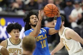 UCLA guard Tyger Campbell (10) drives to the basket past Colorado guard KJ Simpson.