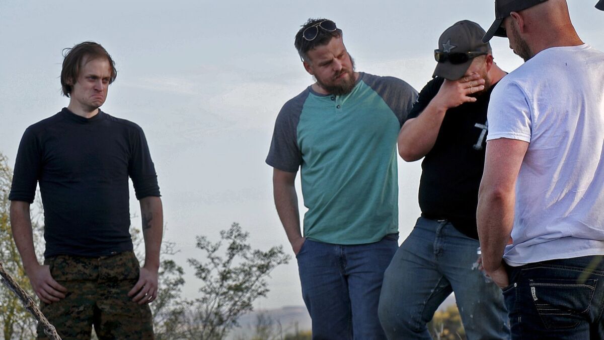 Emotions are raw as friends and former volunteer Syrian fighters spend time at the spot at Sentinel Peak where Kevin Howard killed himself. From left: Taylor Hudson, Justin Schnepp, Al Arsenault, William Allard and William Mostoller. (Gina Ferazzi / Los Angeles Times)