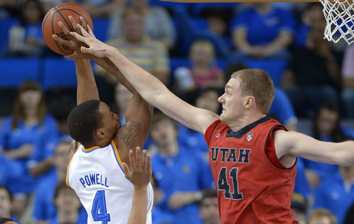 UCLA guard Norman Powell, left, shoots as Utah forward Jeremy Olsen tries to block the shot during the first half of the Bruins' 80-66 win Saturday.