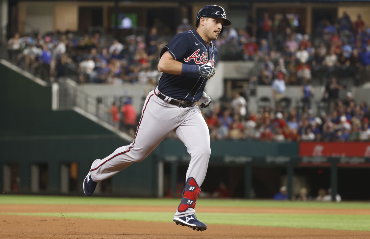 Atlanta Braves' Austin Riley runs the bases after hitting a two-run home run against the Texas Rangers during the first inning of a baseball game Friday, April 29, 2022, in Arlington, Texas. (AP Photo/Ron Jenkins)