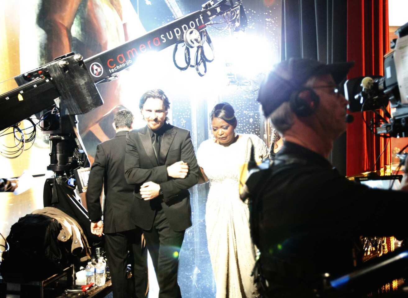 Christian Bale escorts Octavia Spencer offstage after her acceptance speech at the 2012 Academy Awards in Hollywood. Bale had announced Spencer as winner of the Academy Award for her supporting role in "The Help."