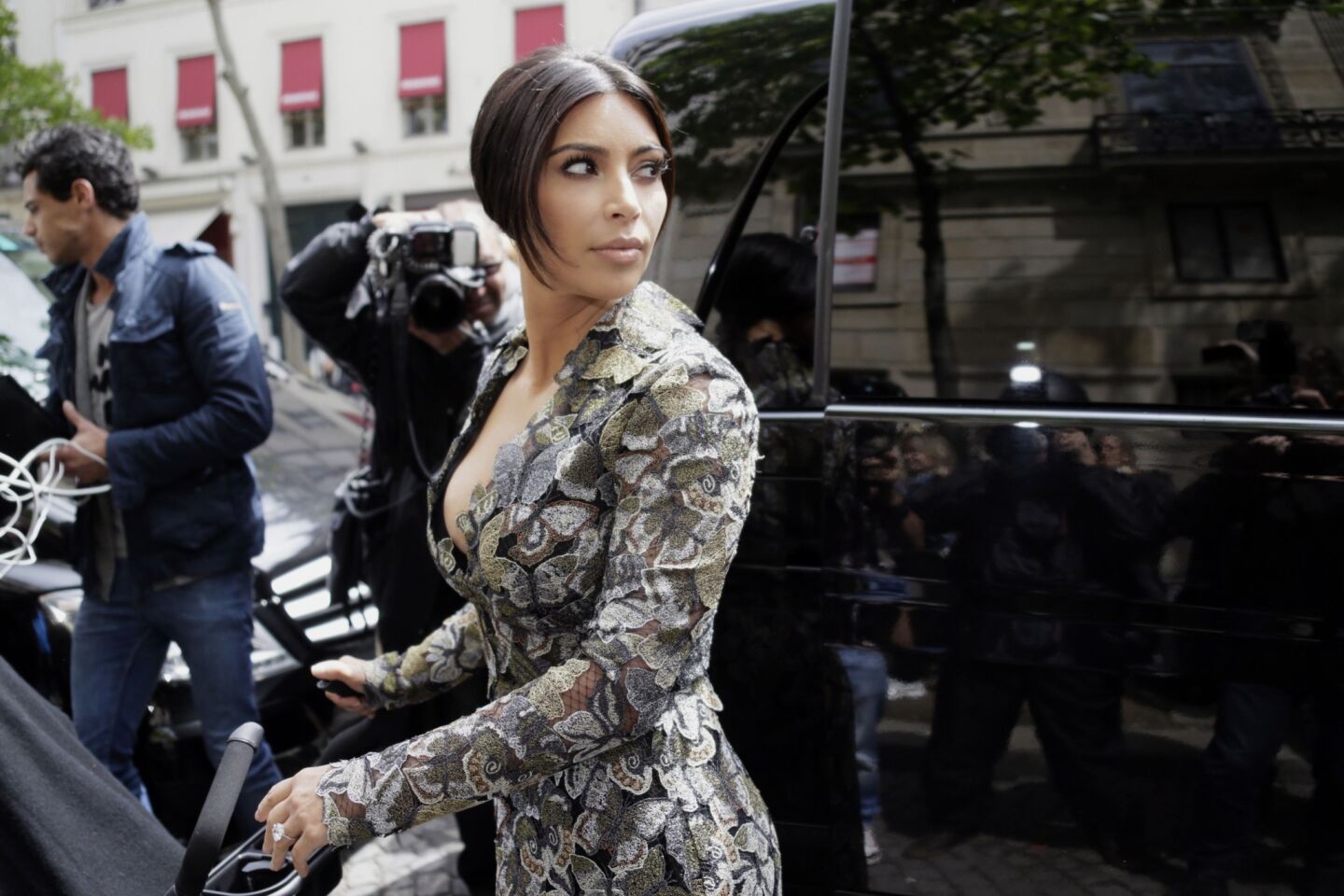 Kim Kardashian is dressed for brunch with designer Valentino as she leaves her Paris hotel on May 23.