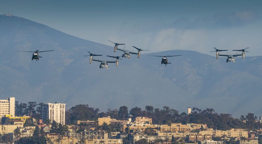 With President Joe Biden aboard, one of two Marine One helicopters, along with three Ospreys, after departing San Diego International Airport, en route to an engagement, reported to be a fundraiser, in Northern San Diego County on Monday.