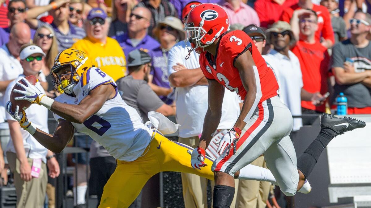 LSU wide receiver Terrace Marshall Jr. (6) makes a reception against Georgia defensive back Tyson Campbell (3) in the first half on Saturday.