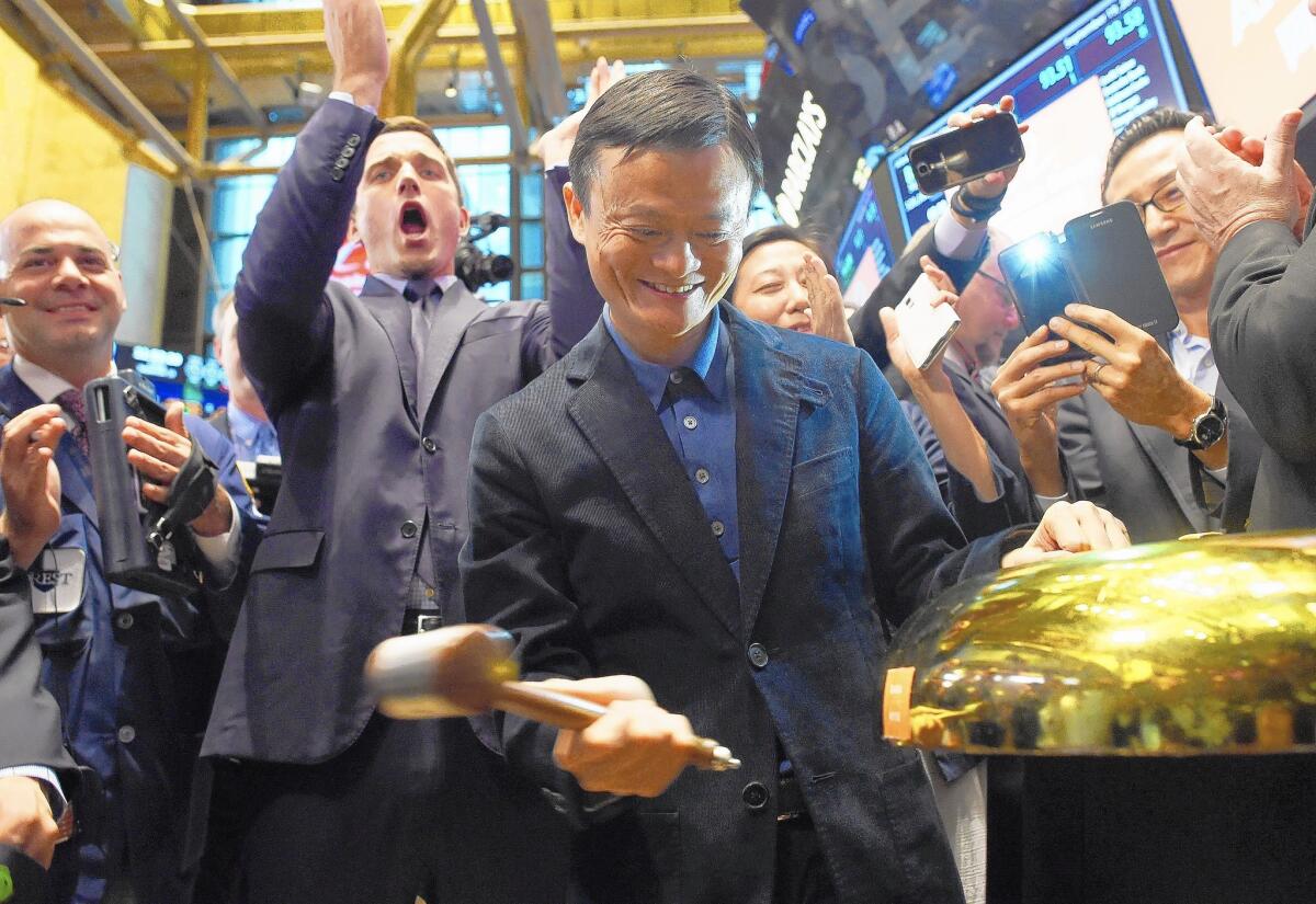 Chinese online retail giant Alibaba founder Jack Ma rings a bell to start the trading of his company's stock on the floor at the New York Stock Exchange in New York on Sept. 19, 2014.