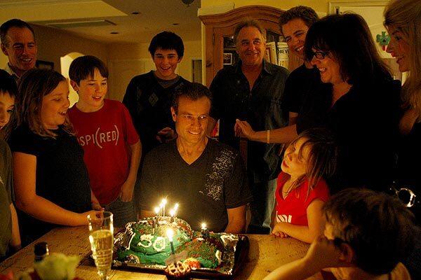 Friends and family sing Happy Birthday to Bob Iritano, center, the day he turned 50. "It's not like I'm on my deathbed," said Iritano of his terminal cancer. "I work. I go to my kids' baseball games."