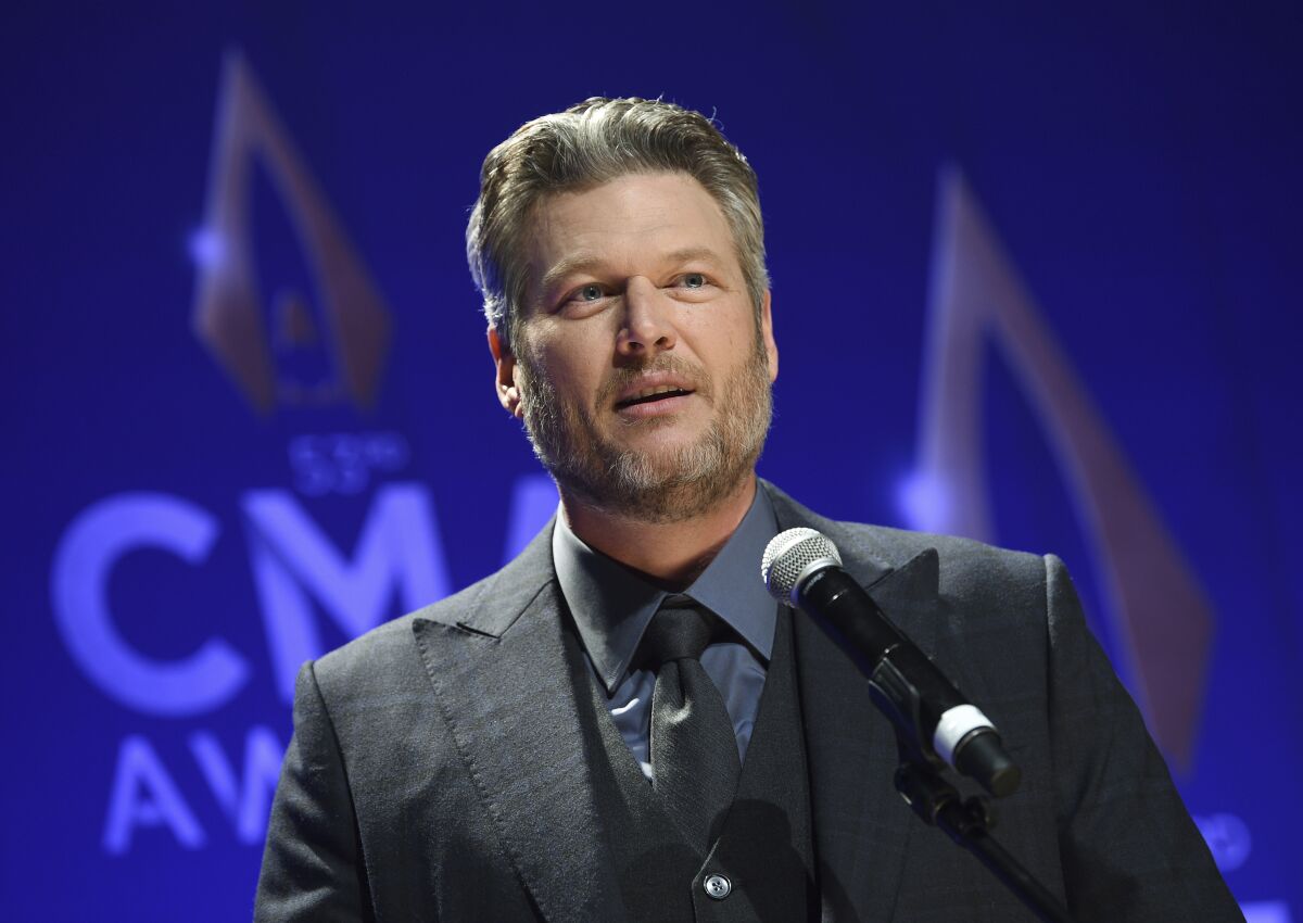 FILE - In this Nov. 13, 2019, file photo, singer Blake Shelton speaks in the press room after winning single of the year award for "God's Country" at the 53rd annual CMA Awards at Bridgestone Arena in Nashville, Tenn. The CMA will provide 4 million meals in cities with large populations of musicians and music industry professionals in partnership with Feeding America, and will also launch a donation challenge to fund additional meals through its MICS Covid-19 initiative Monday, May 10, 2021. Shelton said he is proud to be part of the initiative and drumming up more support to raise funds for the food banks. (Photo by Evan Agostini/Invision/AP, File)