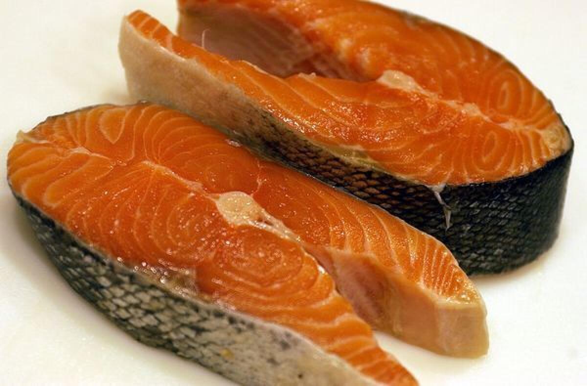 Some salmon steaks. Genetically modified salmon drew closer to FDA approval with publication last week of a long-awaited assessment of environmental effects of the fish.