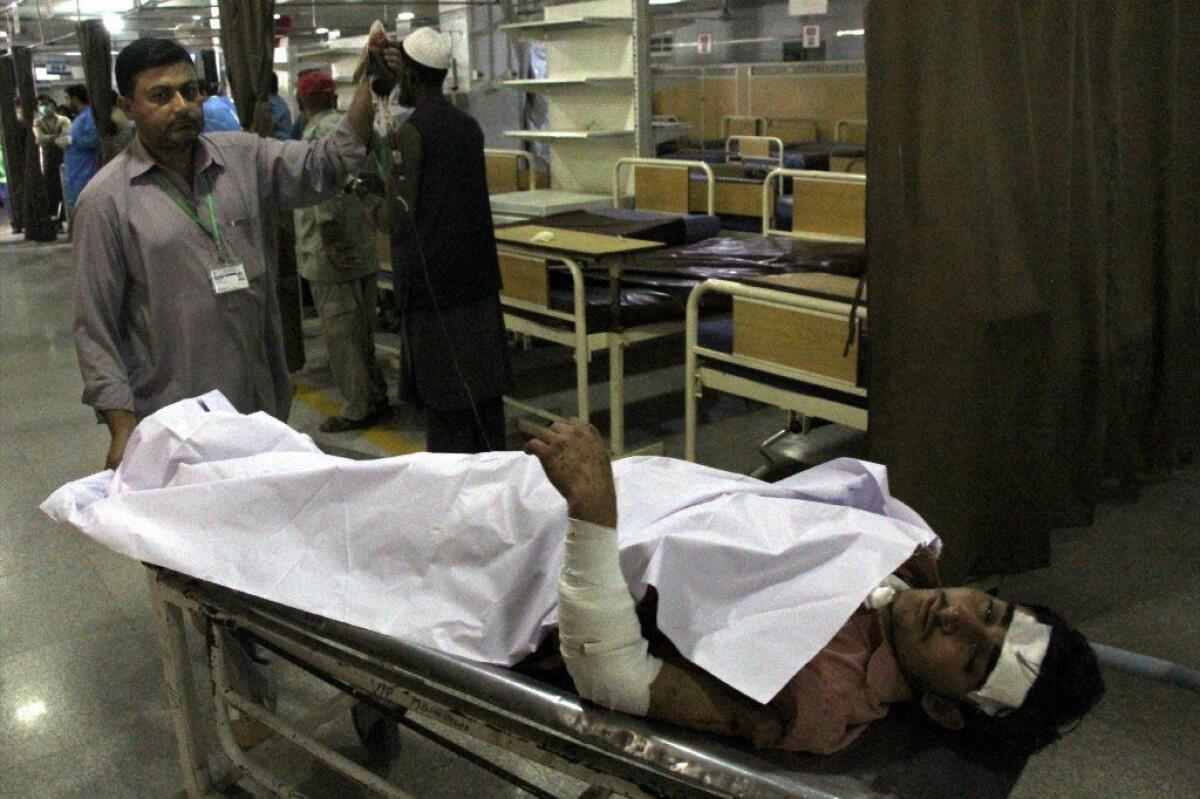 An injured man receives medical treatment at a hospital in Peshawar, Pakistan, after a bombing in the Orakzai tribal region.