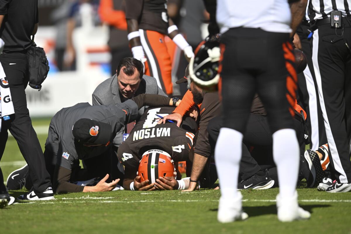 The Browns medical staff attends to Deshaun Watson (4) after the quarterback apparently tore his Achilles tendon.