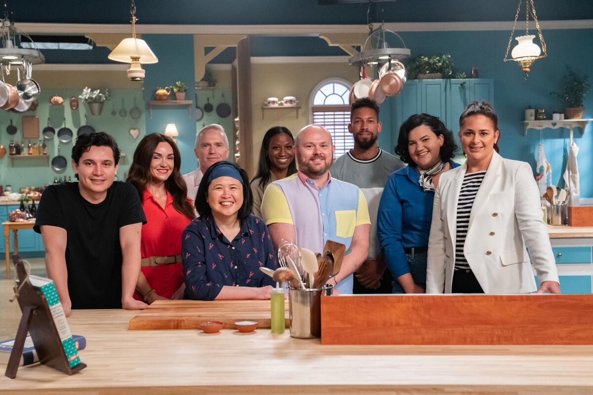 Food Network's "The Julia Child Challenge" head judge Antonia Lofaso, right, with the eight contestants.