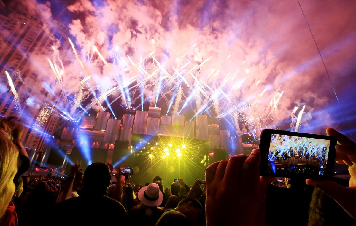 Music fans take in a late-night fireworks show at 2015's Rock in Rio USA at the Las Vegas Festival Grounds.