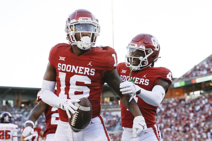 Oklahoma wide receiver Brian Darby, left, celebrates with wide receiver Mario Williams.