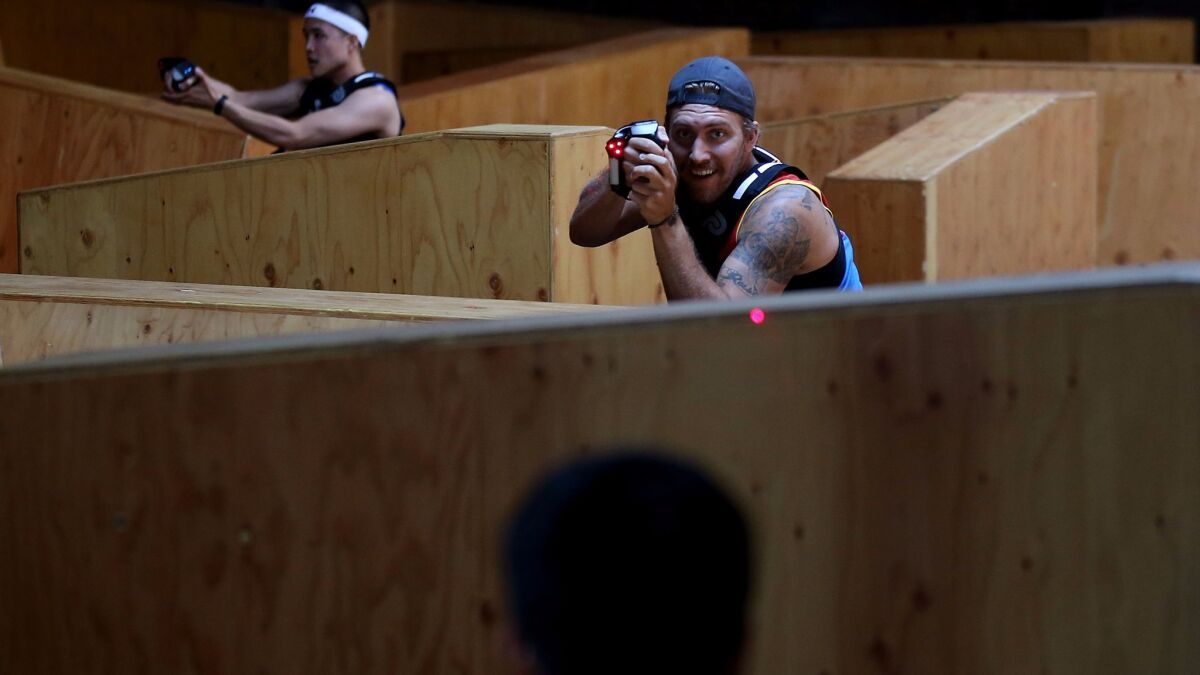 A round of laser tag at the LazRfit gym in downtown Los Angeles. (Luis Sinco / Los Angeles Times)