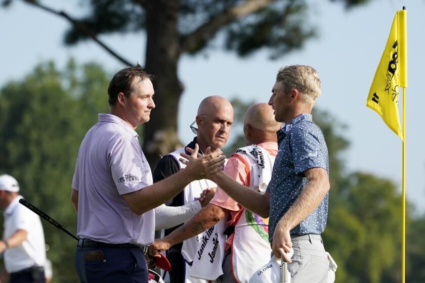 Will Zalatoris greets Sepp Straka after defeating Straka in a playoff in the final round of the St. Jude Championship.