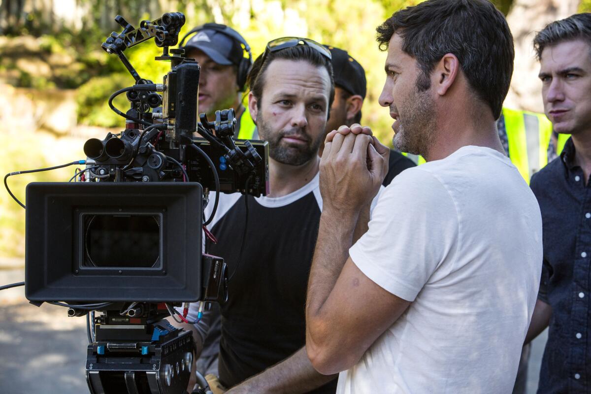 The law is intended to make California more competitive with rival states such as New York, Georgia and Louisiana. Above, Director David M. Rosenthal, in white, talks strategy with cameraman BJ McDonnell on the set of the movie "The Perfect Guy", in Hollywood.