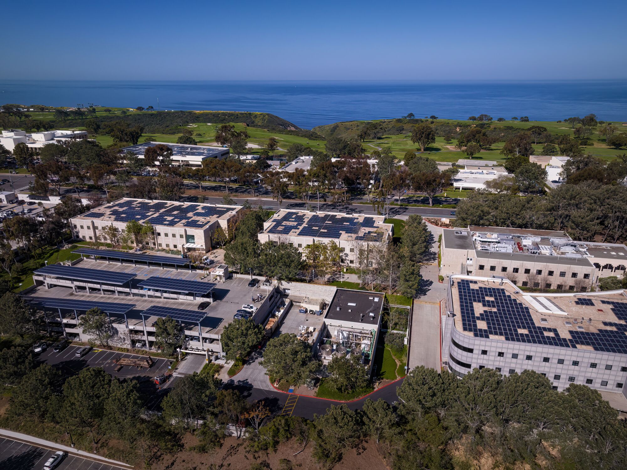 Sanford Burnham Prebys campus in La Jolla has covered its rooftops along and a parking structure in solar panels.