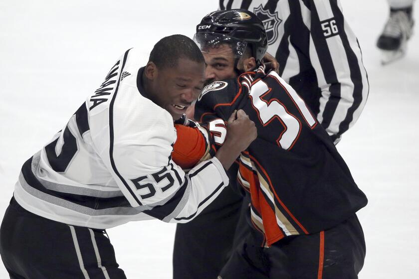 Kings forward Boko Imama, left, and fights Ducks left winger Mike Liambas fight during a preseason game in September 2017.