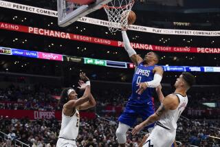 Clippers guard Russell Westbrook shoots Denver Nuggets forwards Zeke Nnaji and Michael Porter Jr. look on