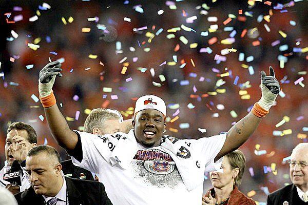 Auburn defensive tackle Nick Fairley celebrates after the Tigers defeated Oregon, 22-19, to win the BCS national championship game at University of Phoenix Stadium in Glendale, Ariz., on Monday night.