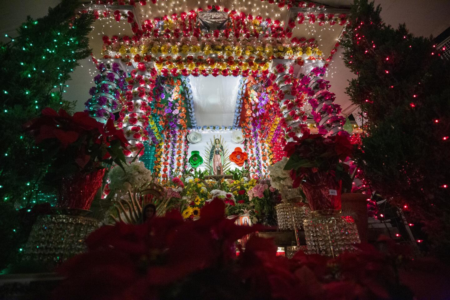 While people in Mexico celebrate el Día de La Virgen de Guadalupe at churches and street altars, many migrants, like Luis Cantabrana of Santa Ana, connect with their roots by keeping this tradition alive in the United States. The celebration of Our Lady of Guadalupe is one of the most important holidays for Mexican Catholics. Even for the non-religious, it is hard to escape her influence in Mexican culture. Her presence is felt even more as her feast approaches on Dec. 12. Religious Mexicans, on either side of the border, show their devotion for la Guadalupana with over-the-top displays. This could involve walking miles on one's knees to her Basilica in Mexico City or, in the case of Cantabrana, building a shrine on the front porch of his house.