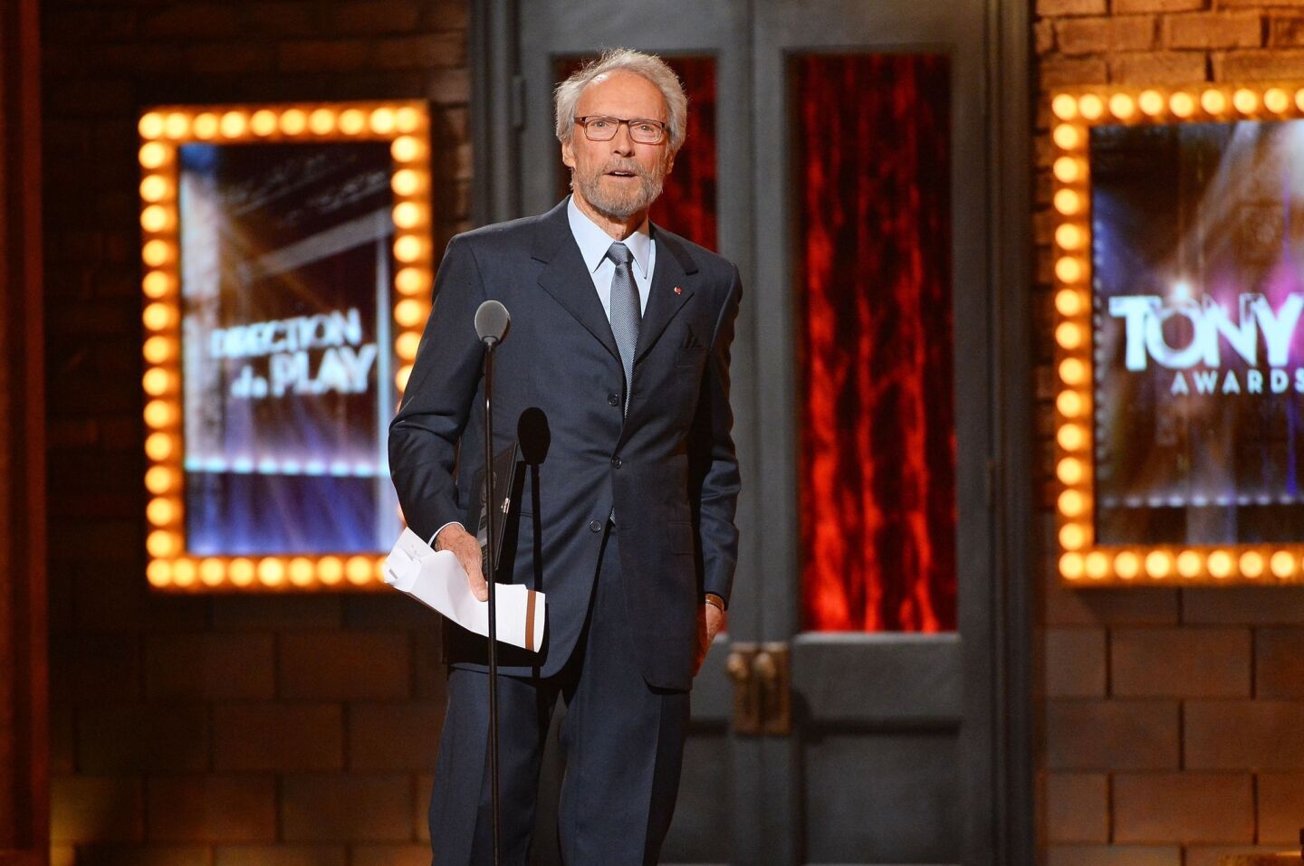 Film director-actor Clint Eastwood presents an award.