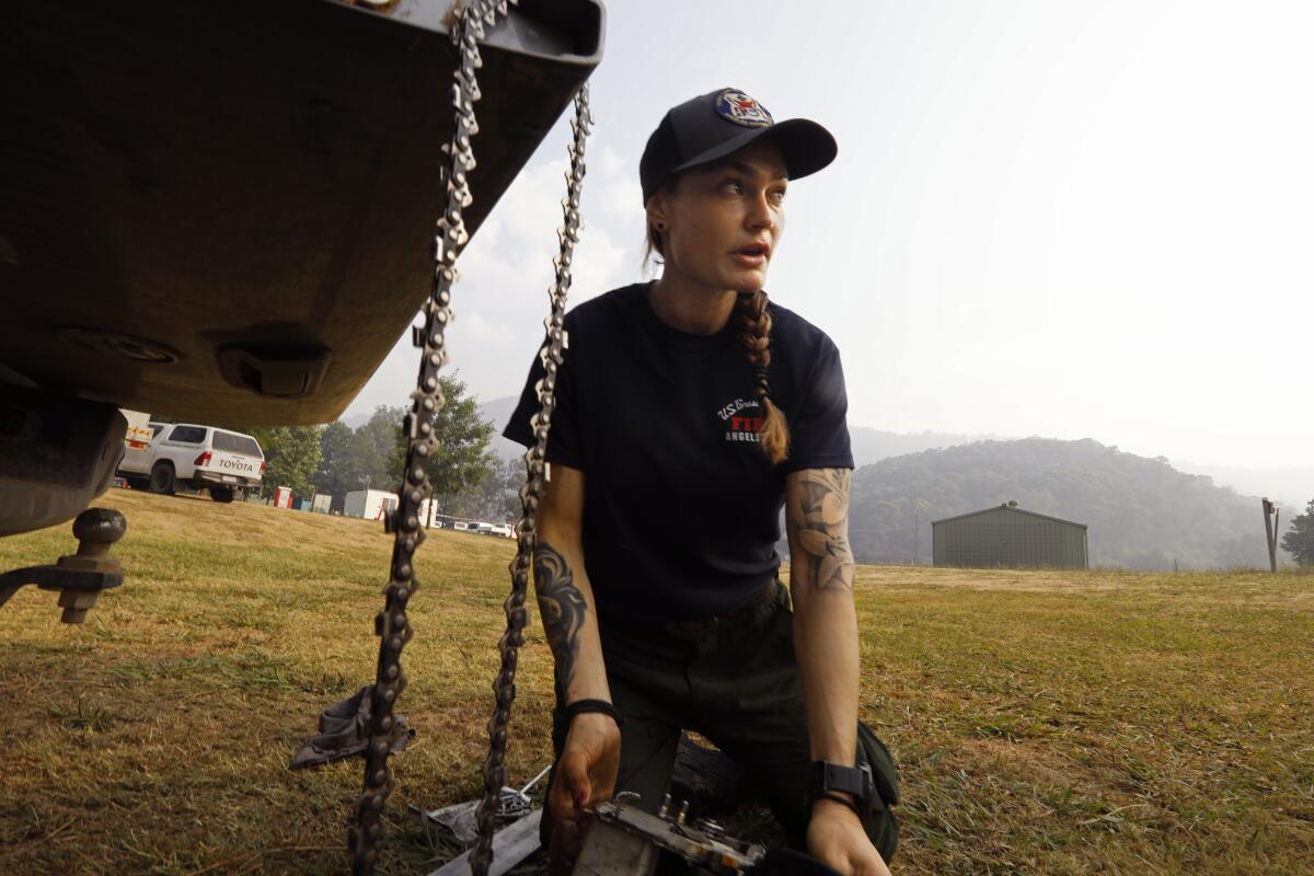 Justine Gude is a 7-year veteran of the Texas Canyon hotshot firefighters, based in the Angeles National Forest. Deployed to Australia, she cleans a chain saw before going out into the field to knock back bush fires in the Alpine National Park. “You try to take a bite out of it and if it doesn’t work you pull back and you take another bite," she said.
