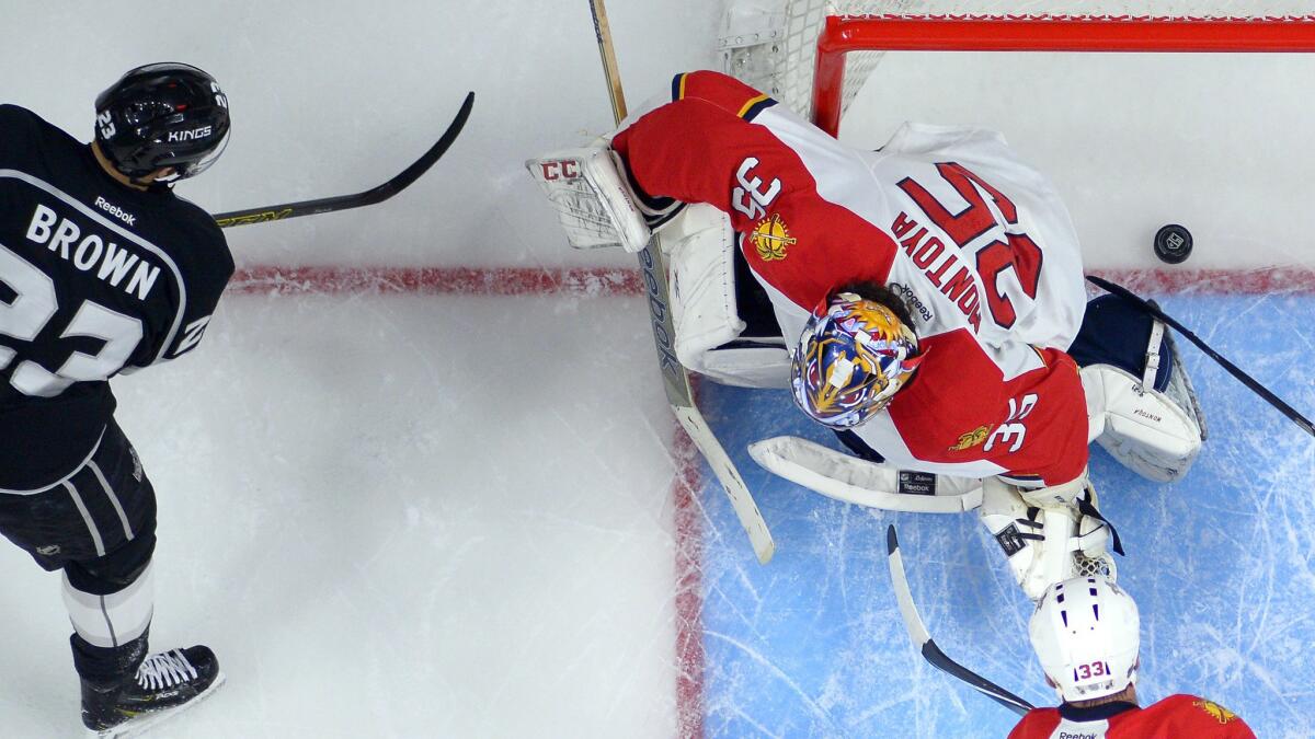 Kings captain Dustin Brown, left, scores on Florida Panthers goalie Al Montoya during the third period of the Kings' 5-2 win Tuesday.
