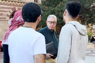 John Strauss, a USC economics professor, was captured on camera talking to students